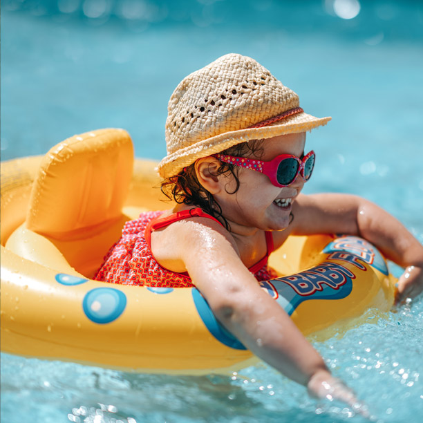 Girl swimming in pool with gas pool heater