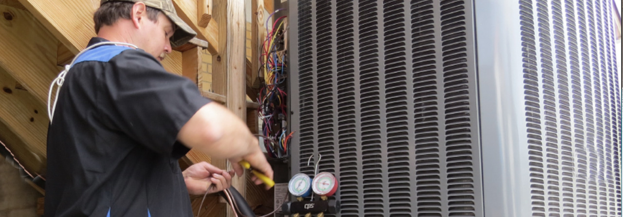 technician repair on HVAC Amana Heat Pump