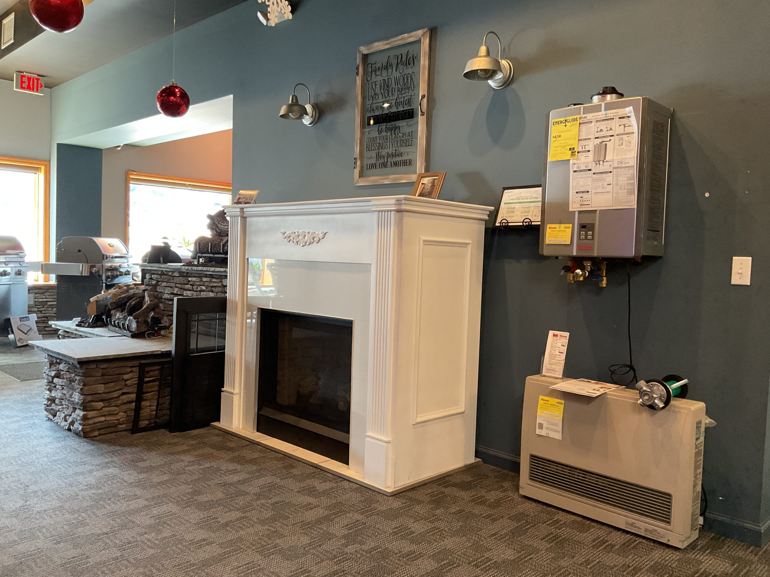 Shaffer's Bottled Gas showroom with vent free fireplace, Rinnai tankless hot water, and Rinnai direct vent furnace