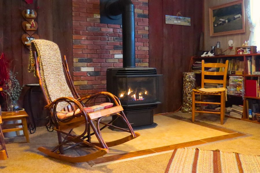 Living room with a rocking chair and Regency U39 Direct Vent Stove