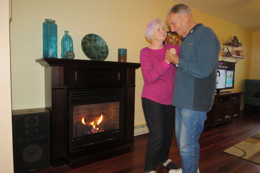 Couple dancing beside Symphony Vent Free Fireplace